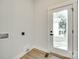 Laundry room features a white door with a window at 513 Sacco St, Belmont, NC 28012