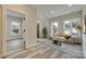 Bright living room with many windows, luxury vinyl plank flooring and neutral-toned furniture at 513 Sacco St, Belmont, NC 28012
