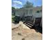 Back entrance with steps leading to the door, and partial view of the backyard at 5200 Queen Anne Rd, Charlotte, NC 28217