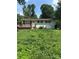 Charming single-story home with a lovely front porch and a partially-covered front yard at 5200 Queen Anne Rd, Charlotte, NC 28217
