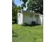 Exterior side view of the house with white painted brick and vinyl siding at 5200 Queen Anne Rd, Charlotte, NC 28217