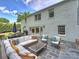 A luxurious backyard patio with comfortable furniture, a dining area, and lush green surroundings at 5436 Topping Pl, Charlotte, NC 28209