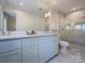 Bathroom features a double sink vanity, large mirror, and walk-in shower with marble tile at 5436 Topping Pl, Charlotte, NC 28209