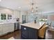 This eat-in kitchen offers stainless appliances, marble countertops, and white cabinetry at 5436 Topping Pl, Charlotte, NC 28209