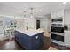 Bright kitchen features a marble island, stainless appliances, and is open to the dining area at 5436 Topping Pl, Charlotte, NC 28209