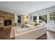 Bright living room with fireplace, comfortable sofa, and natural light at 5436 Topping Pl, Charlotte, NC 28209