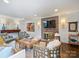 Elegant living room featuring a brick fireplace, hardwood floors, and stylish decor at 5436 Topping Pl, Charlotte, NC 28209