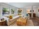 Inviting living room with white sofa, natural light, and stylish decor at 5436 Topping Pl, Charlotte, NC 28209