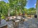 Beautiful patio with comfortable seating, a dining set, and a well-manicured lawn, perfect for entertaining at 5436 Topping Pl, Charlotte, NC 28209