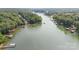 Breathtaking aerial view showcasing the lake and lush landscape, offering a serene and private waterfront lifestyle at 6836 Summer Hill Dr, Denver, NC 28037