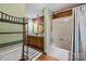 Bathroom featuring wooden walls, wood floors, a shower, and a wooden vanity at 6836 Summer Hill Dr, Denver, NC 28037