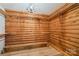 Wood walled closet with shelving and bench and chandelier at 6836 Summer Hill Dr, Denver, NC 28037