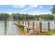 Picturesque wooden dock with rope accents, providing a tranquil waterfront experience with stunning lake views at 6836 Summer Hill Dr, Denver, NC 28037