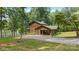 Charming log home with a porte cochere, surrounded by lush greenery and serene lake views, a true retreat at 6836 Summer Hill Dr, Denver, NC 28037