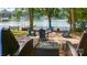 Cozy fire pit area with Adirondack chairs and lake views, perfect for entertaining guests at 6836 Summer Hill Dr, Denver, NC 28037