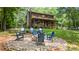 Inviting outdoor fire pit area with Adirondack chairs and comfortable seating, perfect for relaxing evenings at 6836 Summer Hill Dr, Denver, NC 28037