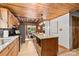 Spacious kitchen with a central island, stainless steel appliances, and an adjacent dining area at 6836 Summer Hill Dr, Denver, NC 28037