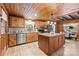 Charming kitchen with wood cabinets, granite countertops, and stainless steel appliances at 6836 Summer Hill Dr, Denver, NC 28037