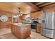 Well-appointed kitchen featuring wood cabinets, granite countertops, and modern appliances at 6836 Summer Hill Dr, Denver, NC 28037