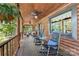 Inviting porch features rocking chairs, wood floors and views of the forest at 6836 Summer Hill Dr, Denver, NC 28037