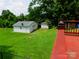 Spacious backyard features a couple of storage buildings at 714 Shady Dr, Albemarle, NC 28001