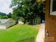 View of the backyard with two sheds and a detached garage for storage space at 714 Shady Dr, Albemarle, NC 28001