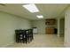 Finished basement area features a bar area with tile floors and recessed lighting at 714 Shady Dr, Albemarle, NC 28001