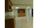 Finished basement with tile floors, built-in shelving and cabinets, and recessed lighting at 714 Shady Dr, Albemarle, NC 28001