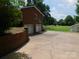Exterior view of home with a large driveway, two-car garage, and a basketball hoop at 714 Shady Dr, Albemarle, NC 28001