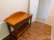 Entryway featuring a classic wooden console table with drawers and a lower shelf, leading to additional rooms at 714 Shady Dr, Albemarle, NC 28001
