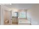 Bright bathroom with granite counters, soaking tub, and tile surround at 7172 Sylvan Retreat Dr, Denver, NC 28037