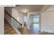 Spacious foyer with staircase, wood floors, and easy access to the kitchen and living spaces at 7172 Sylvan Retreat Dr, Denver, NC 28037