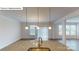Kitchen island features granite countertops, sink, and stainless-steel pendant lights at 7172 Sylvan Retreat Dr, Denver, NC 28037