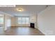 Bright living room with a fireplace and large windows, perfect for entertaining at 7172 Sylvan Retreat Dr, Denver, NC 28037