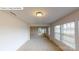 Spacious living room with plush carpeting and large windows allowing ample natural light at 7172 Sylvan Retreat Dr, Denver, NC 28037