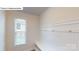 Convenient mudroom features beadboard accent wall, storage bench, and coat hooks at 7172 Sylvan Retreat Dr, Denver, NC 28037