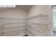 Spacious walk-in closet with multiple shelves, providing ample storage space at 7172 Sylvan Retreat Dr, Denver, NC 28037
