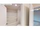Clean, white bathroom features a shower-tub combo with built-in shelving at 7190 Sylvan Retreat Dr, Denver, NC 28037