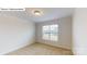 Neutral bedroom with carpet, window, white walls, and bright natural light at 7190 Sylvan Retreat Dr, Denver, NC 28037