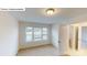 Cozy bedroom featuring neutral carpet and ample natural light from the window at 7190 Sylvan Retreat Dr, Denver, NC 28037