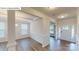 Inviting home entryway with decorative wainscoting, wood floors, and natural light at 7190 Sylvan Retreat Dr, Denver, NC 28037
