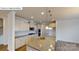 Modern kitchen featuring stainless appliances, granite counters, and island with sink at 7190 Sylvan Retreat Dr, Denver, NC 28037