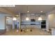 Gourmet kitchen featuring granite counters, stainless appliances, and island with sink at 7190 Sylvan Retreat Dr, Denver, NC 28037