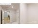 Functional laundry room includes tile flooring and wire rack shelving at 7190 Sylvan Retreat Dr, Denver, NC 28037