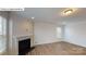 Bright living room features a fireplace, wood floors, and large windows at 7190 Sylvan Retreat Dr, Denver, NC 28037