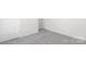 Bedroom with neutral carpeting, white trim and a white door, creating a clean, bright space at 804 Candy Dr, Statesville, NC 28677