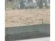 A partially framed image of an empty lot with some vegetation visible in the background at 804 Candy Dr, Statesville, NC 28677