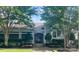 Beautiful clubhouse with well-manicured landscaping, offering a welcoming community gathering space at 8350 Brickle Ln, Huntersville, NC 28078