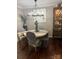 Traditional dining room featuring an elegant chandelier and a decorative china cabinet at 8350 Brickle Ln, Huntersville, NC 28078
