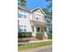 Attractive two-story townhouse with manicured bushes and a cozy front porch at 8350 Brickle Ln, Huntersville, NC 28078